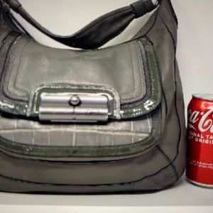 Coach Cross body purse in gray leather with crocodile  pattern on front pocket.